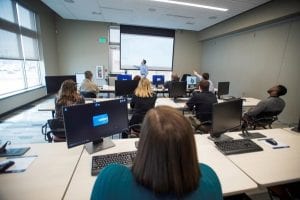 Instructor teaches a class in a GSC classroom