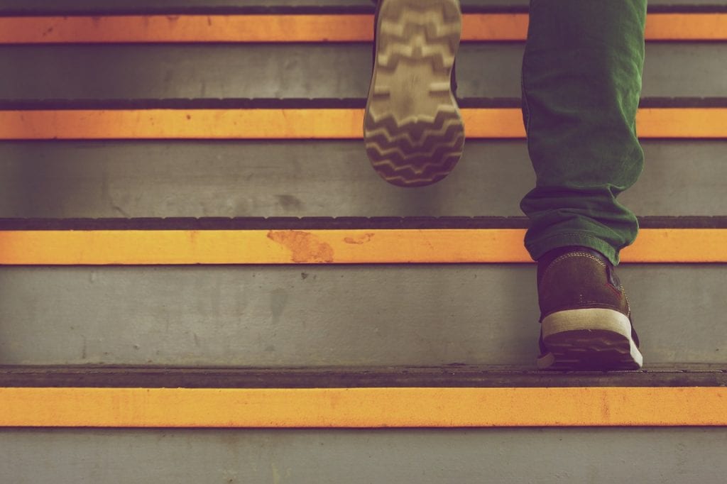 Feet of someone ascending steps