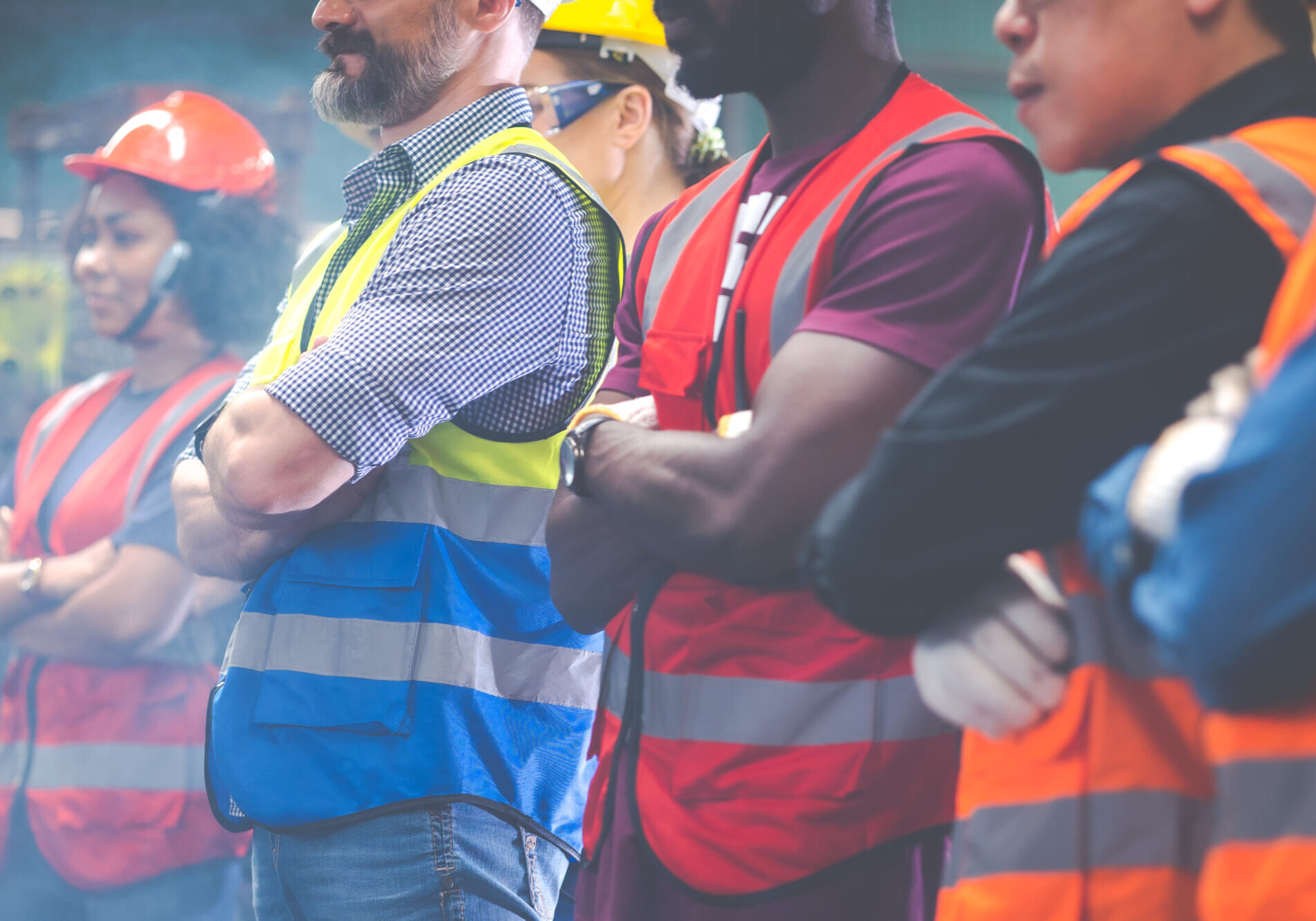 Arms crossed. Professional team working at workplace. Unity and teamwork concept. Portrait engineer factory manager worker and mechanic team together in factory workplace